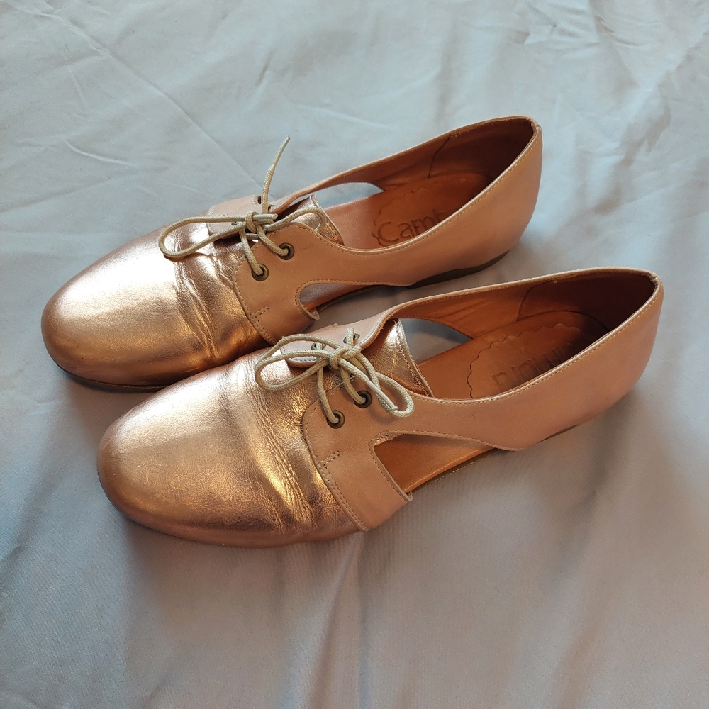 Flat shinny pink shoes. Made in Chile.